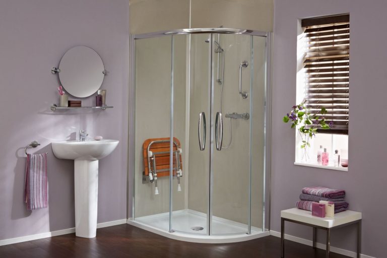 Easy access low profile enclosed shower cubicle with shower seat