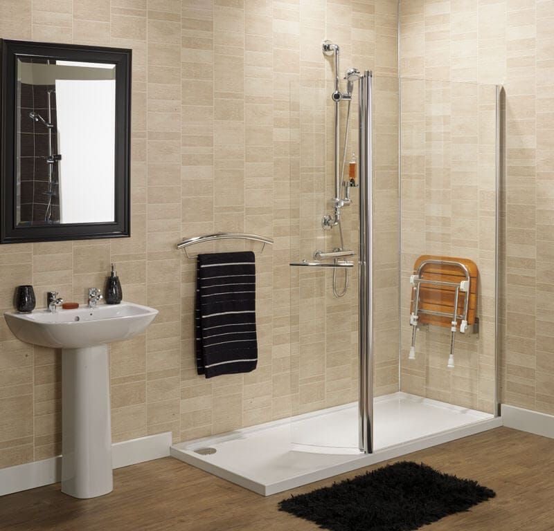 Low level easy access shower with an accessible shower chair.